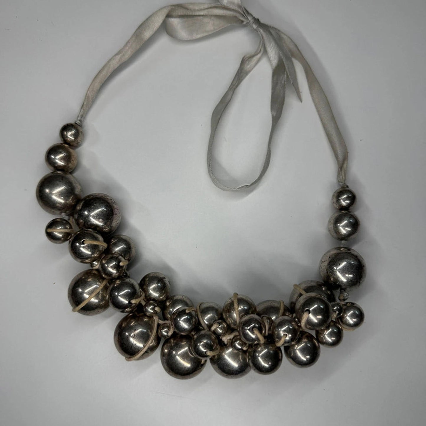Vintage metal orbs cluster necklace