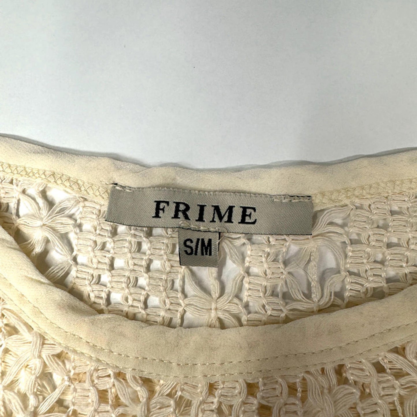 Vintage sleeveless crochet lace top with fringe hem