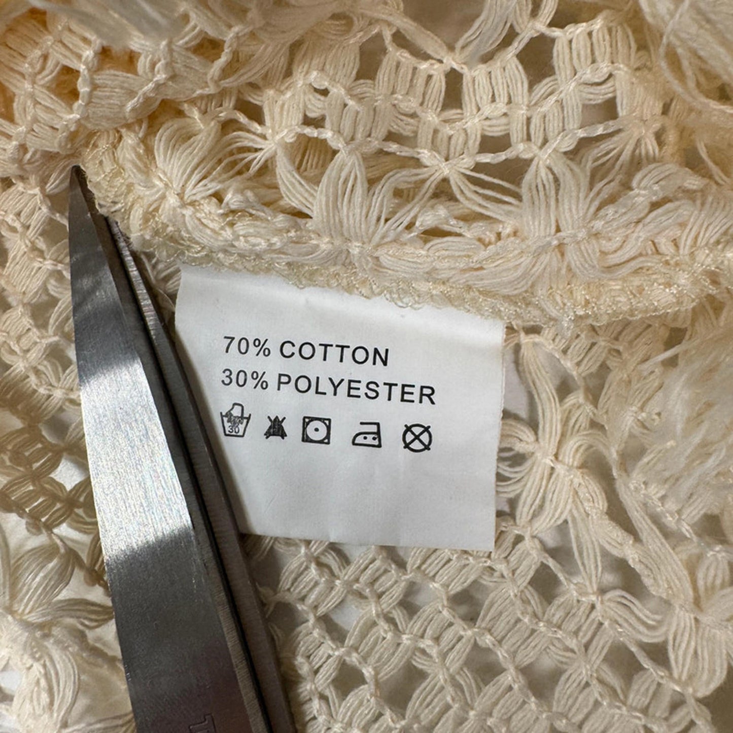 Vintage sleeveless crochet lace top with fringe hem