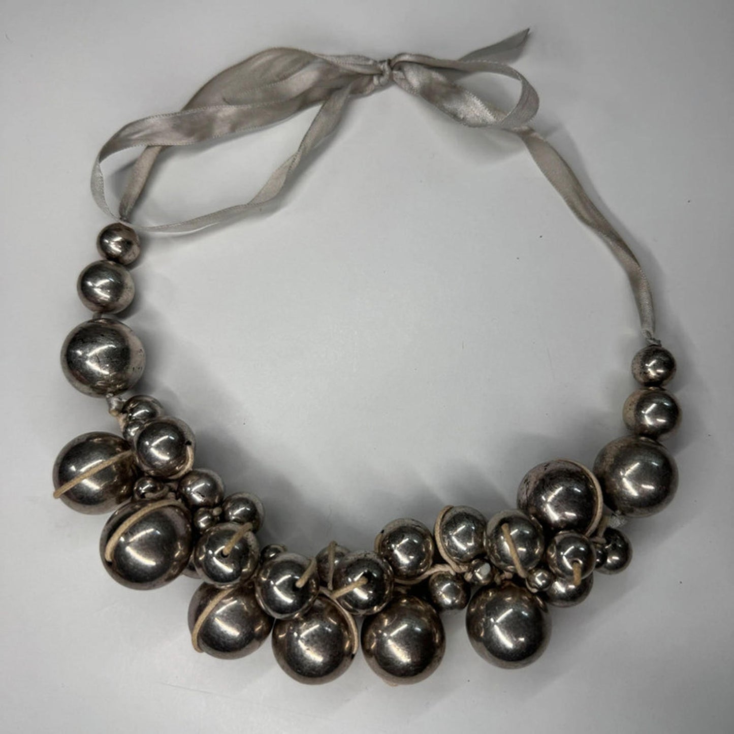 Vintage metal orbs cluster necklace