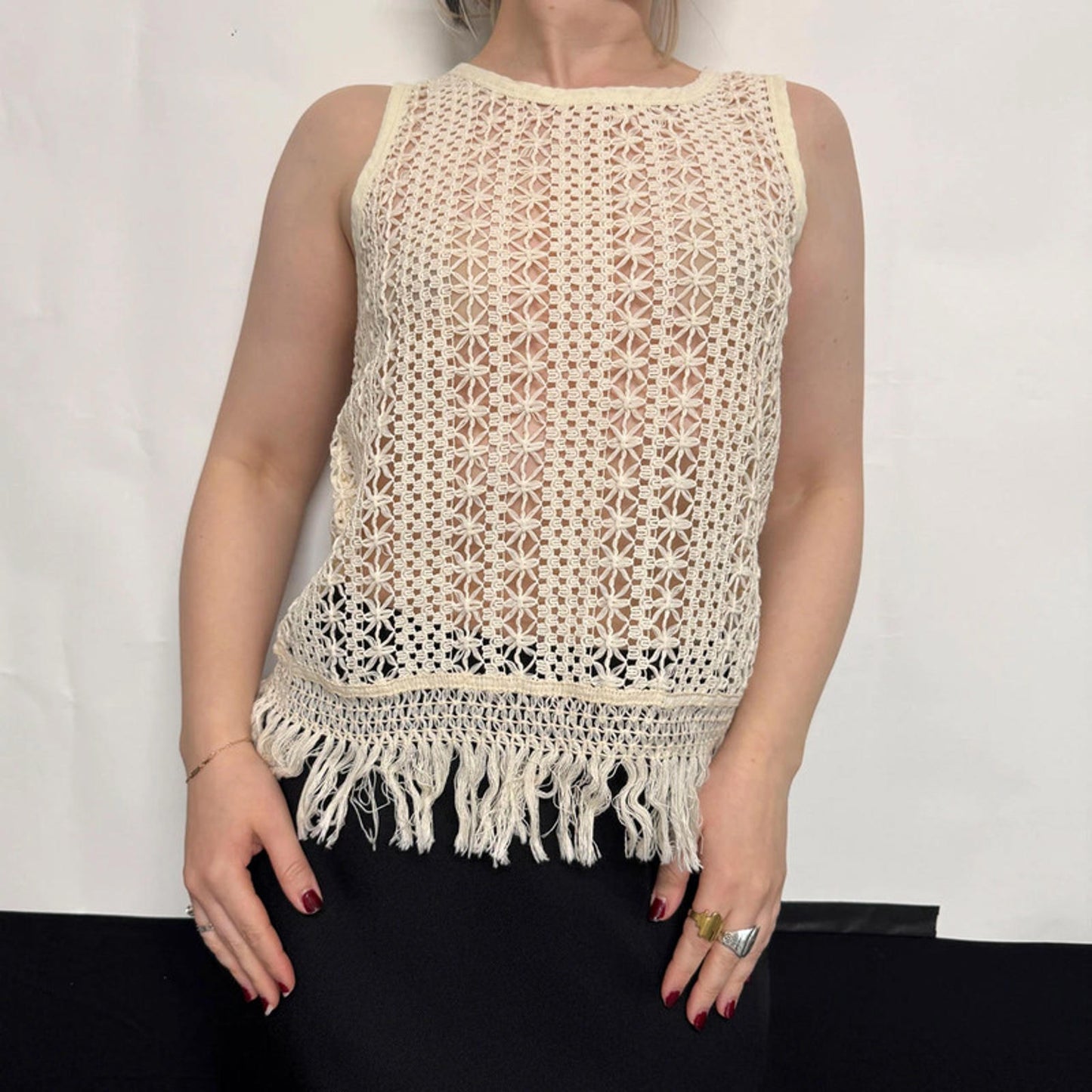 Vintage sleeveless crochet lace top with fringe hem